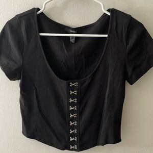 Forever 21 black crop top with corset silver detailing up the front!